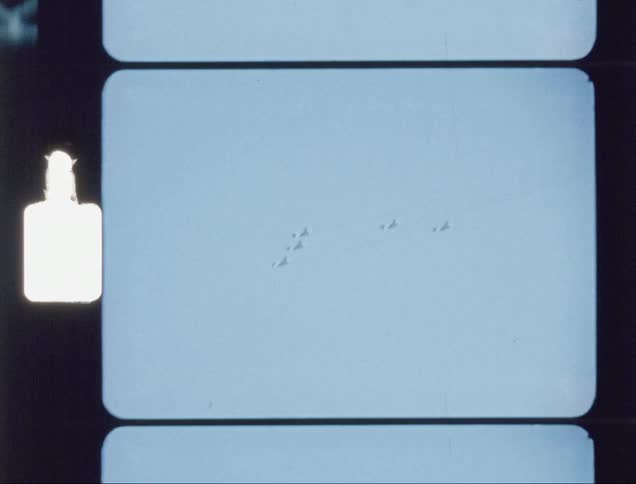 A group of airplanes fly together in the sky