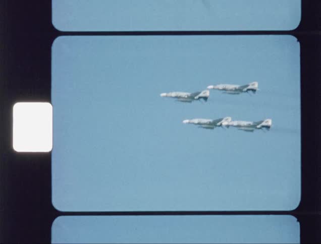 Three jets fly high passing the sky above