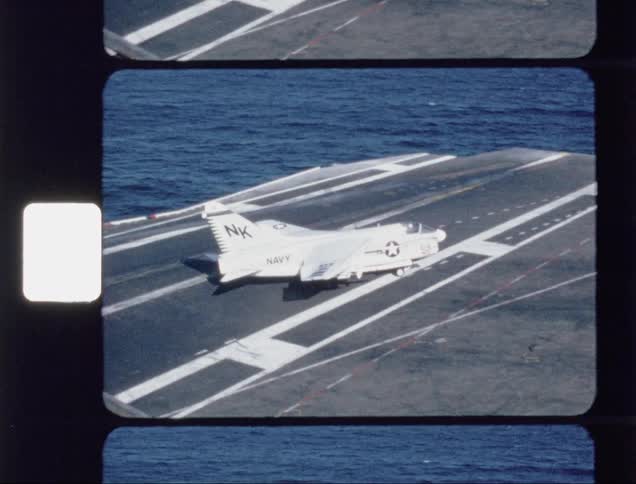 An airplane rolling forward on an aircraft carrier