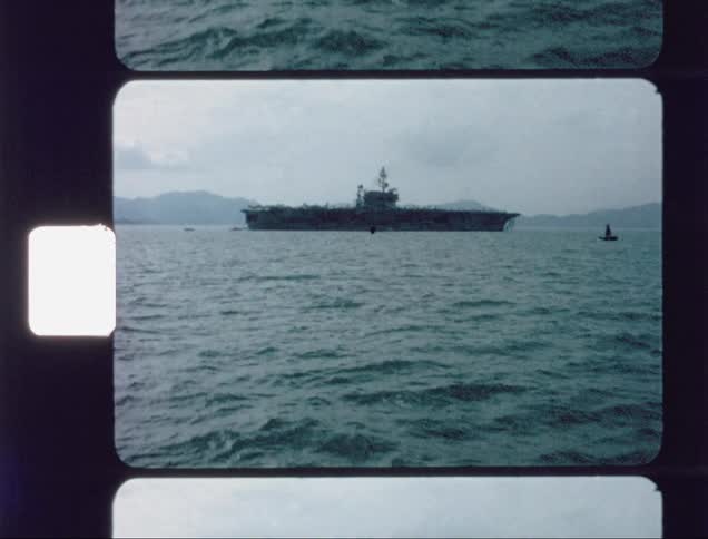 A large ship floats on the ocean