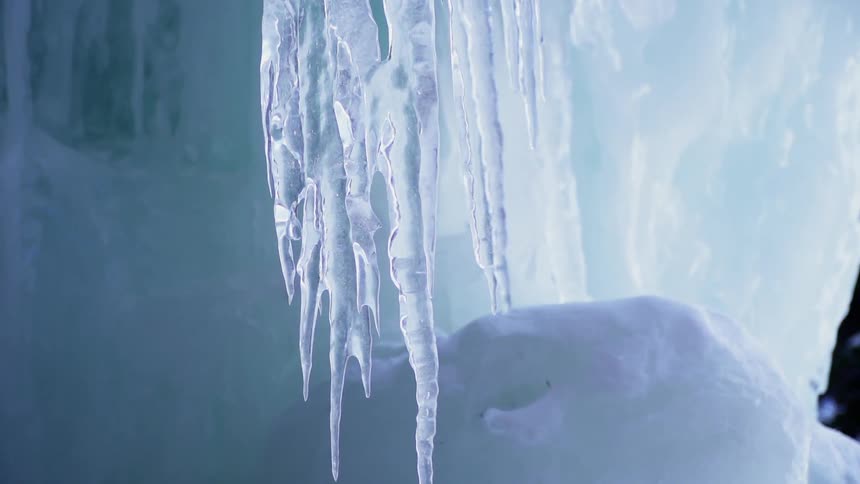 Icicles hang low in the icy cave