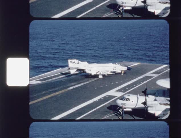 Airplane rolls slowly on a landing strip in the middle of water