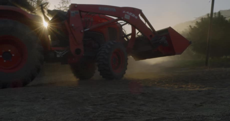 The bulldozer moves down the trail