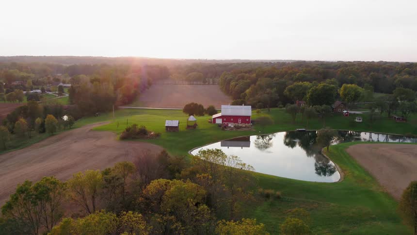 The farm house has a small pond on the side