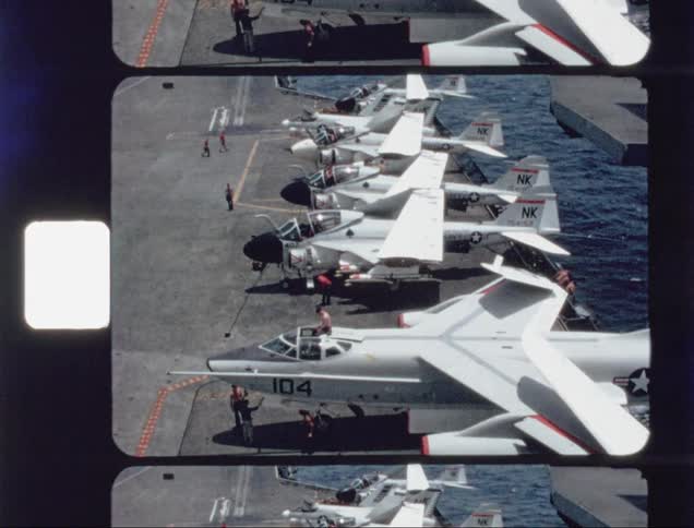 Planes are lined up on an aircraft carrier