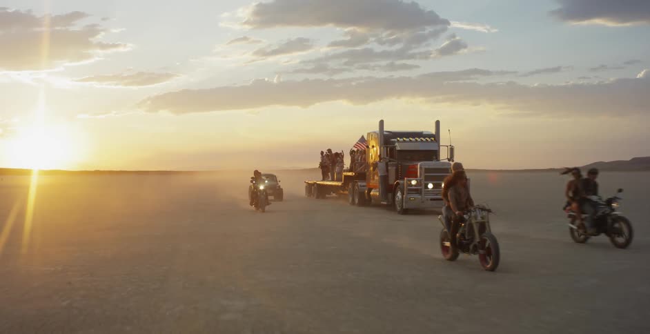 Motorcycles and a car pass a tractor trailer