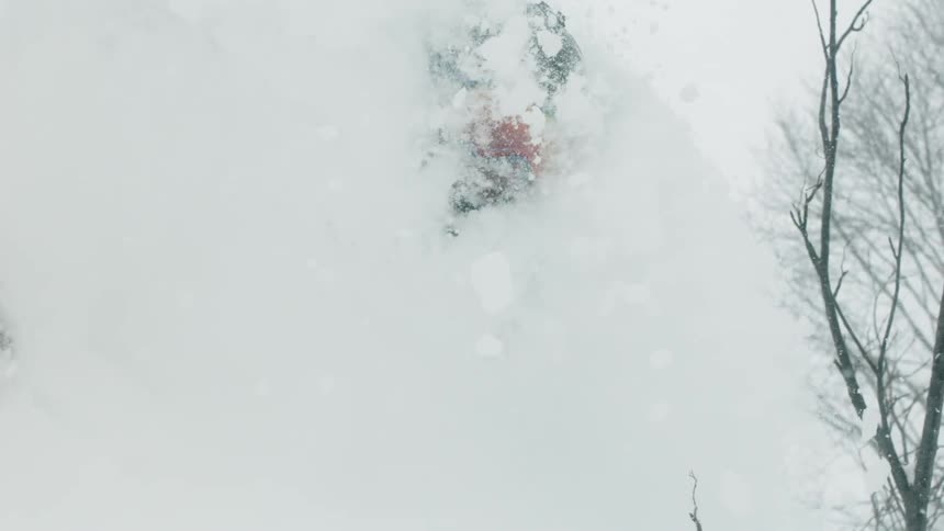 A skier turns through the snow