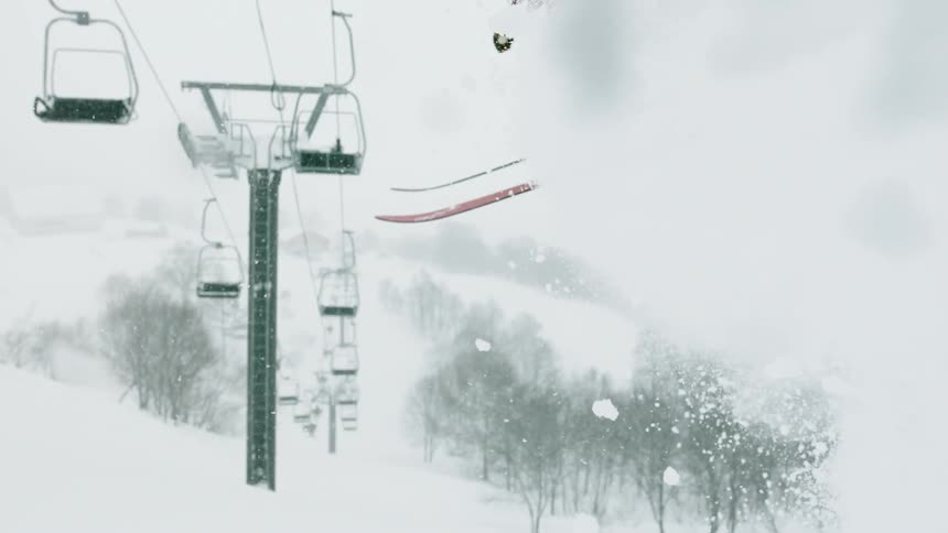 A skier jumps into the air at a mountain resort