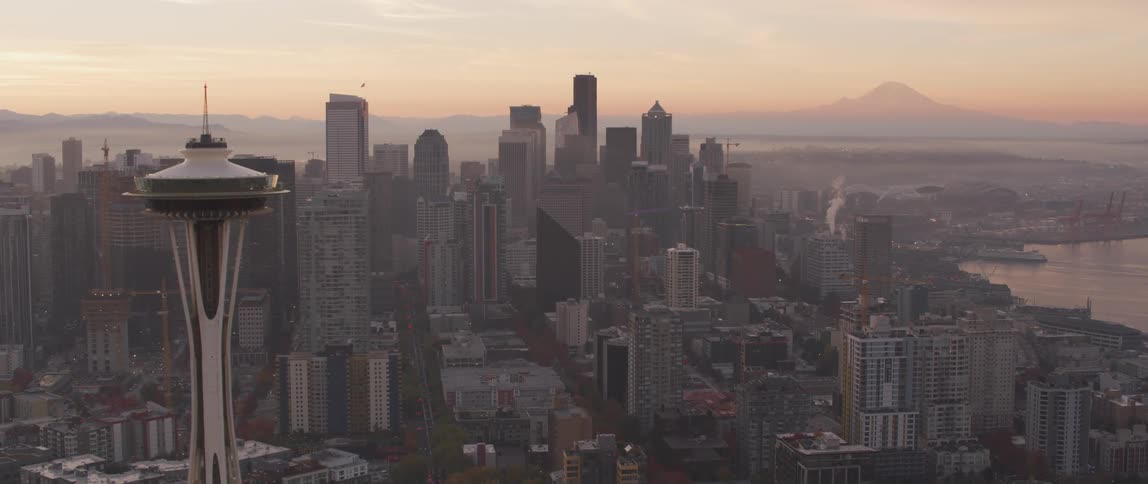Seattle's space needle towers above the city at dusk