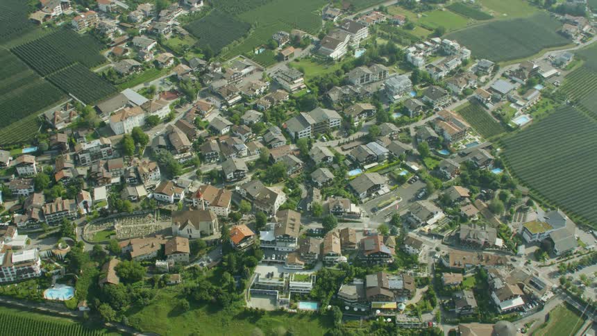 Aerial view of a small city and some traffic moving through it