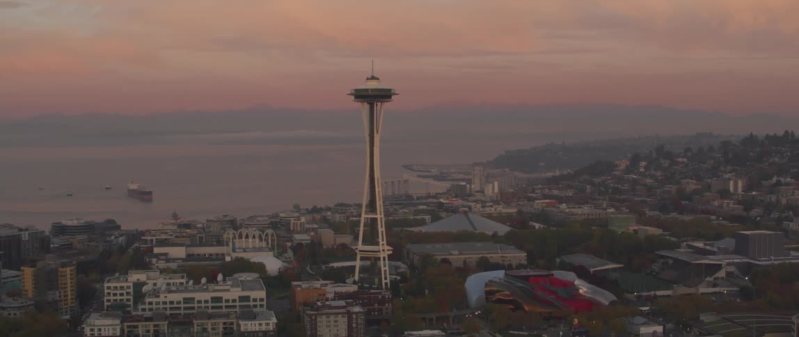 Seattle's space needle towers above the city at dusk