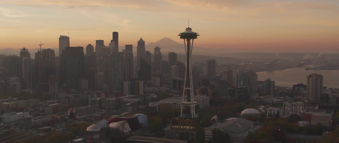 Seattle's space needle towers above the city at dusk