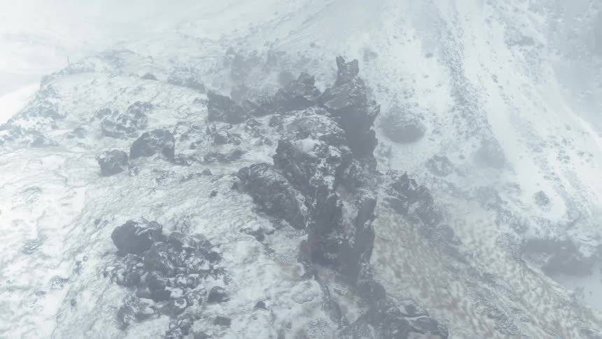 Snow falls in the mountains