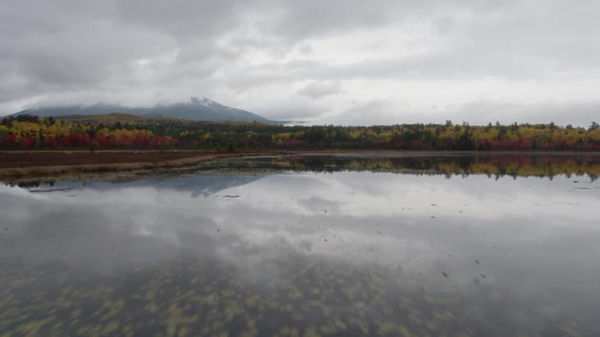 The water is calm on a cloudy day
