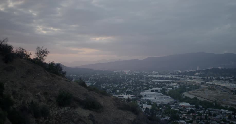 Brushy hills overlooking a city
