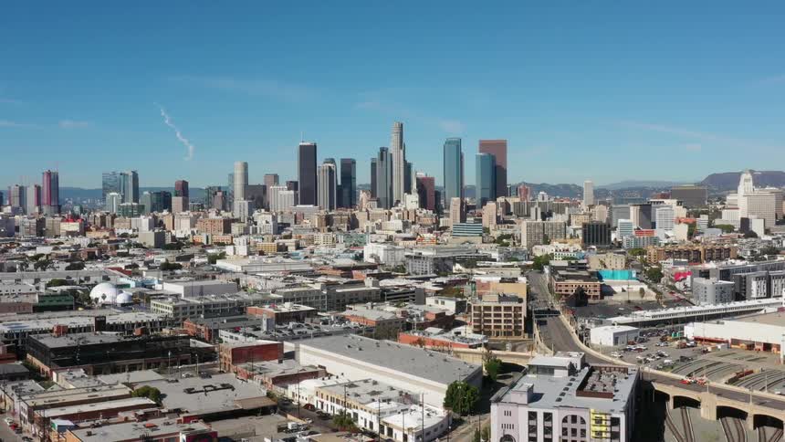 Skyscrapers stand in a city on a clear day