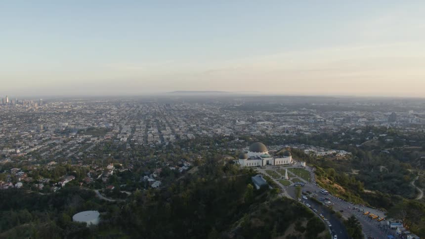 A large building on a hill overlooks the city below