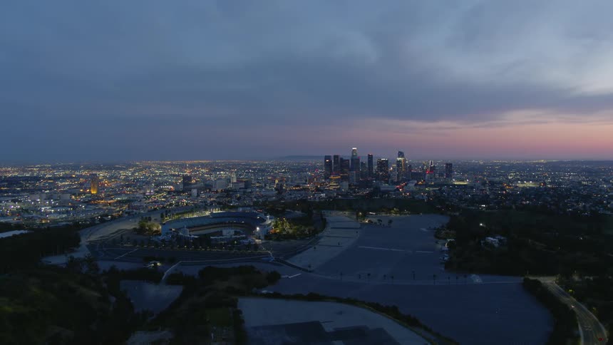 The sky is full of thick clouds over the city at dawn