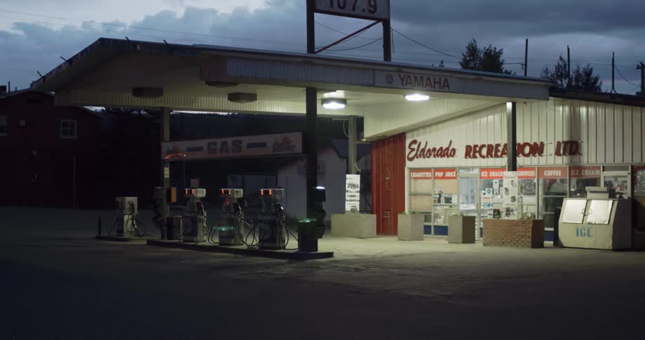 Gas station pumps lit up at night