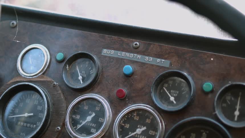 The cockpit has many gauges with buttons
