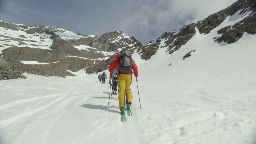 People cross country ski in a line
