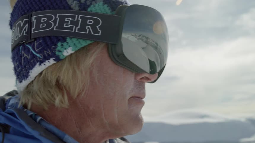 Man pulls his goggles over his eyes