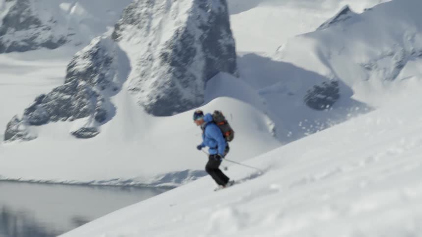 The skier moves very fast down the slope