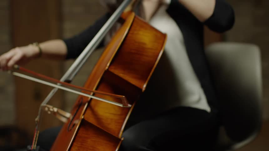 A woman plays a cello