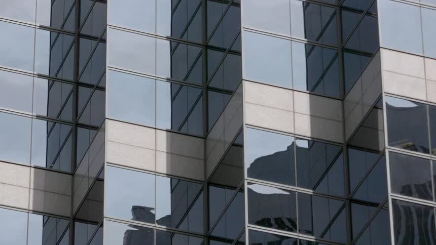 Windows of a building reflecting objects