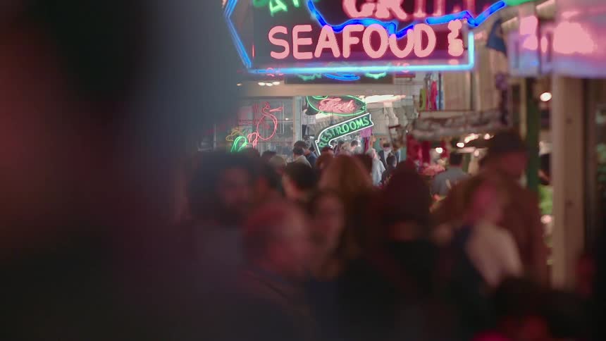 People walk in a seafood market