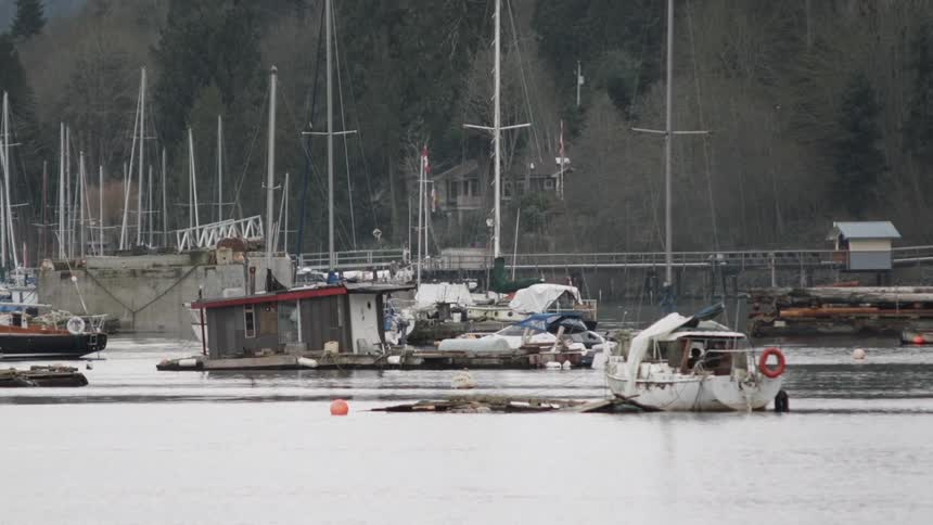 Abandoned boats in a small harbor