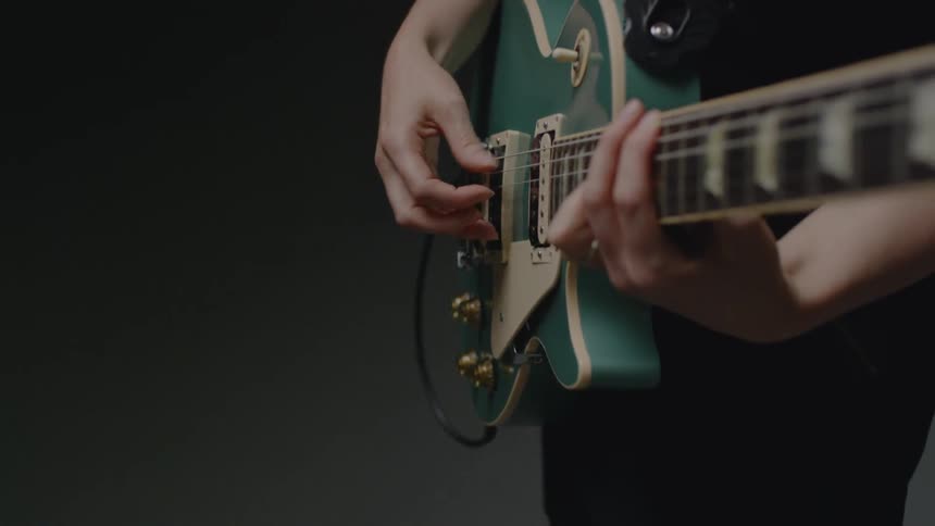 A person is strumming the guitar