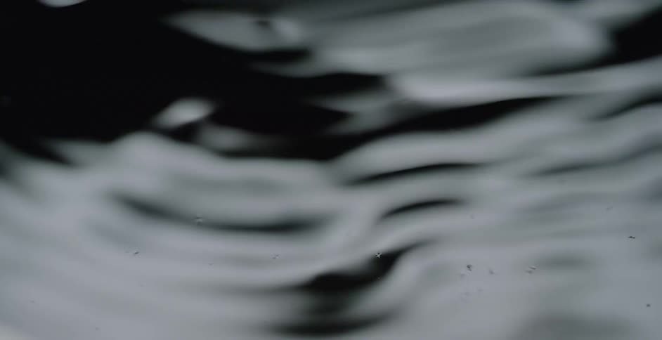 The dark waters are rough with waves moving around
