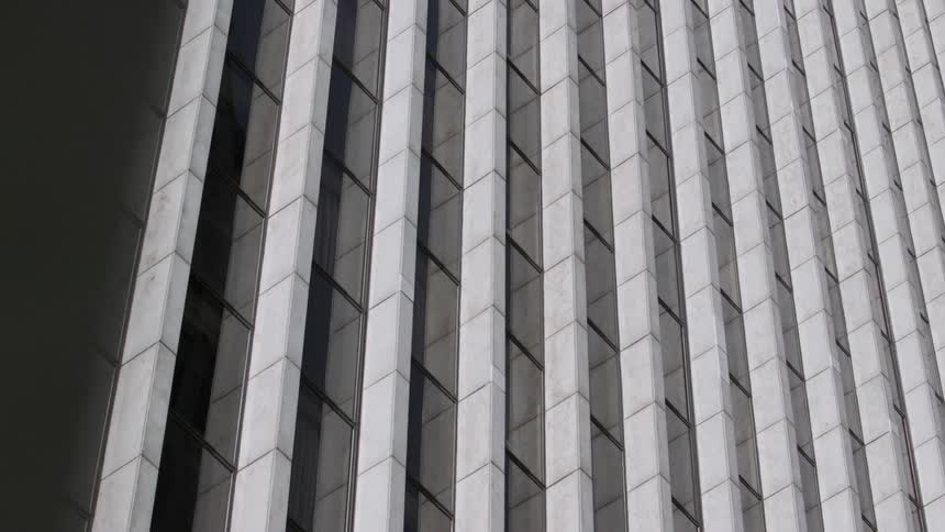 A tall city building towers overhead