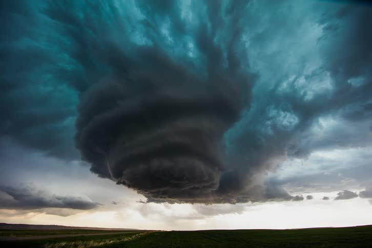 A storm cell brews and rotates in the sky