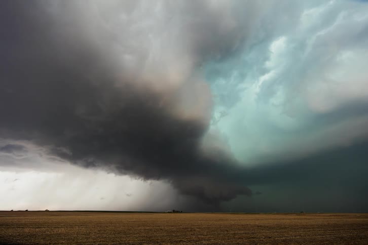 Ahead a very large storm is forming with lightning flashing