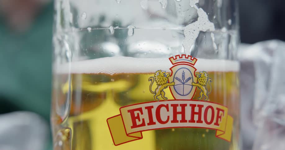 Foam rises to the top of a beer glass