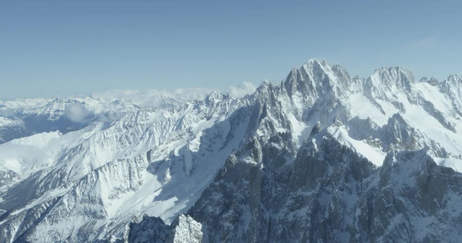 The tall mountain ahead has a clear sky above