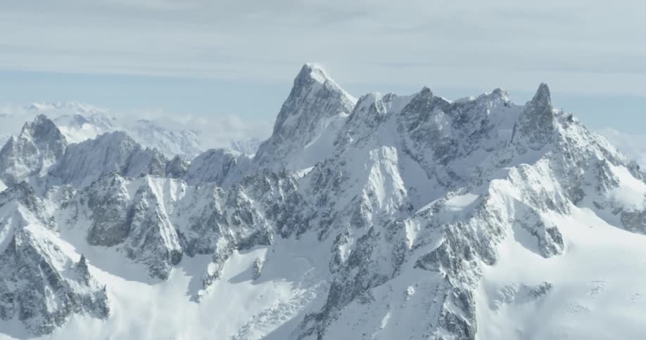 Snow-covered mountains on a cloudy day