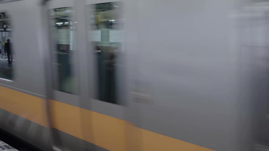 A subway train car arrives at a subway station
