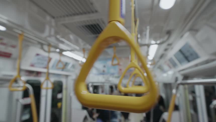 Grab bars sway as a train travels