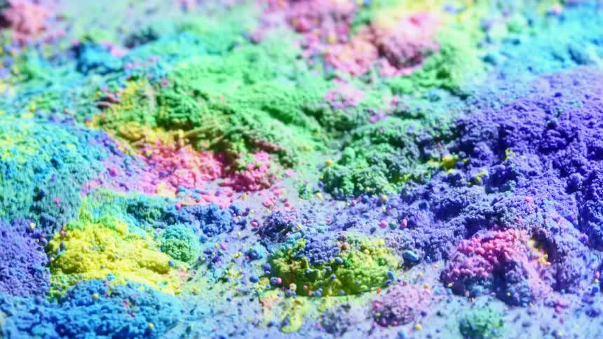 Multi-colored powder vibrates wildly