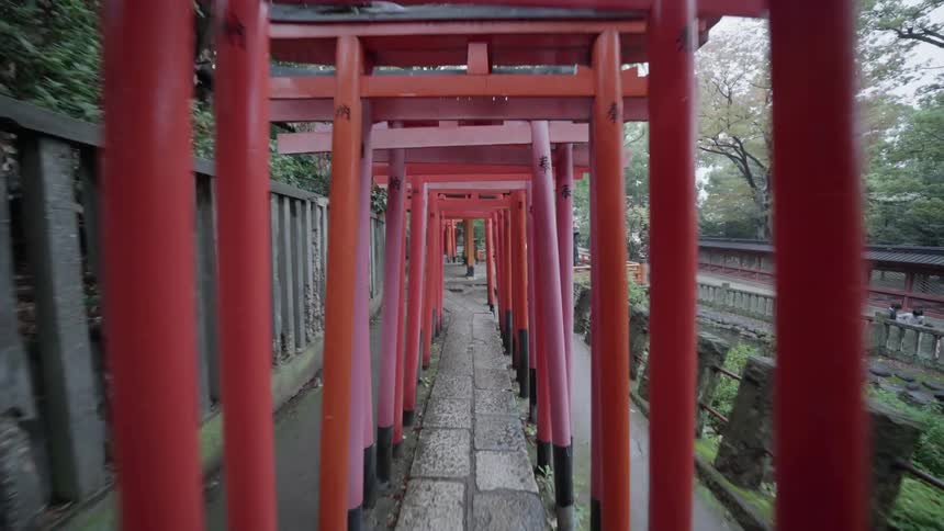A pathway is covered by red decorative overhangs