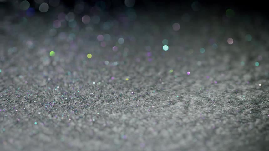 The glittery magnetic liquid moves around in the dark and creates a shiny bokeh