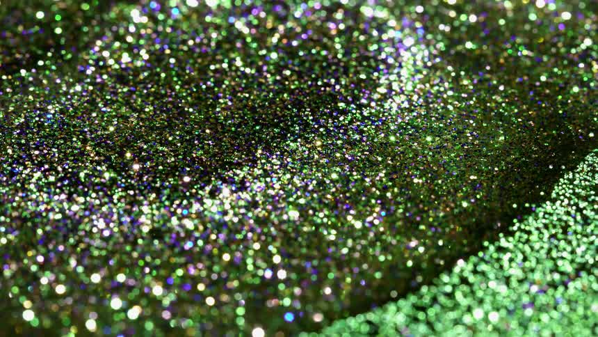 Green glitter swirls in a circle formation