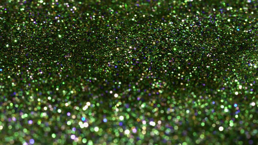 Green Glitter flows and swirls around