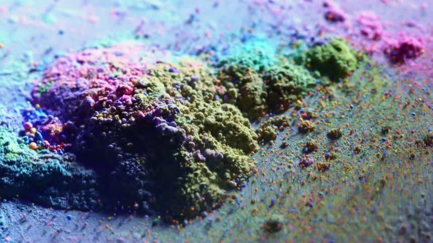 Colored granules are vibrating on a surface