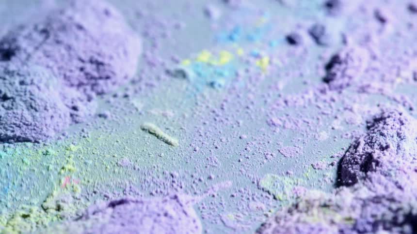 Holi powder vibrates and moves on a plate