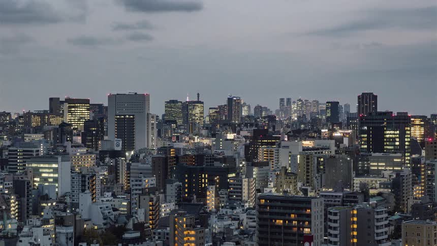 Clouds pass over the city skyline