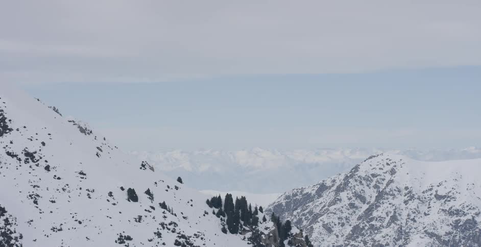 Snow covers mountains in the wilderness